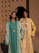 Azure Constellation turquoise Moroccan kaftan with star embroidery under an ivory brocade mansouria, shown alongside a second look