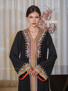Ink Garden one-piece Moroccan caftan in black with polychrome hand embroidery, full-length front view