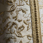 Ivory Dawn kaftan close-up of gold embroidered motifs on ivory fabric